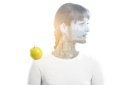 Double exposure of a beautiful girl and night cityscape of New York.の写真素材