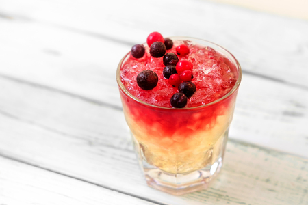 Margarita cocktail with berries on white wood backgroundの写真素材