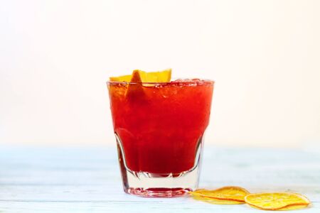 Alcoholic Cocktail , gin, rum with orange slices and ice on white backgroundの写真素材