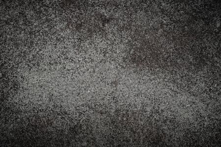 Dark grey stone texture. Background with rough surface