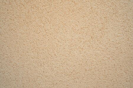 The texture of the sand block of cream color, wall backgroundの写真素材
