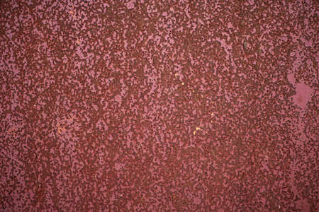 Texture red painted wall with rust spots and rough surface