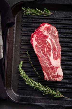 One Perfect raw steak Chuck roll of beef on a black grill panの写真素材