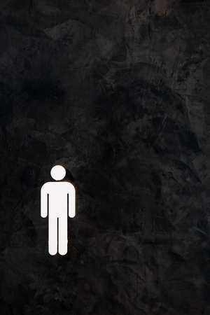 black painted wall with gray strokes and the figure of a manの写真素材