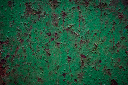 Oxidized rusty green metal wall with corrosion and scratches, Texture of old steel