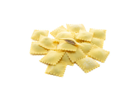 Classic uncooked ravioli pasta with pate topping isolated on a white backgroundの写真素材