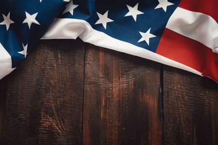 American flag on brown wooden rustic background, banner design, space for text