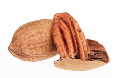 Few pecan nuts isolated on white, one crackedの写真素材