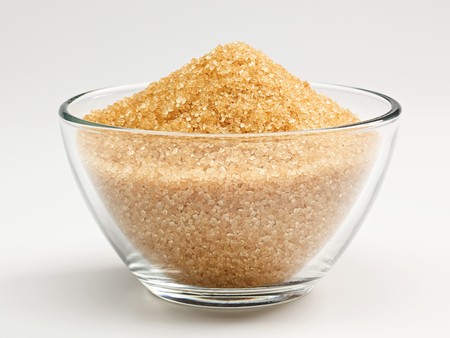 Cane sugar in a glass bowlの写真素材