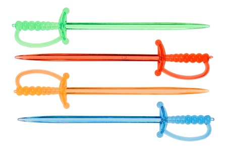 Multicolored plastic food skewers in rapier shape, isolated on whiteの写真素材