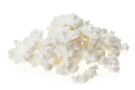 Cottage cheese (curd) heap, isolated on whiteの写真素材