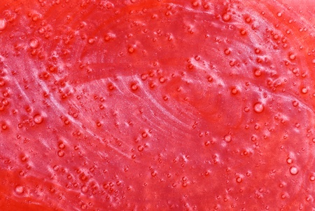 Red shower gel sample, background textureの写真素材