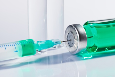 Ampoule and syringe macro still life on whiteの写真素材