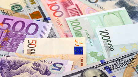 Main word currency Yuan, US Dollar and Euro bank notes concept business background