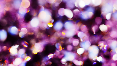 Abstract color bokeh circles background in violet tones