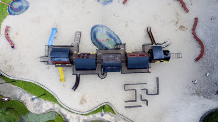 Children's playground that looks like a train. A place for children to play in the sand during summer.の写真素材