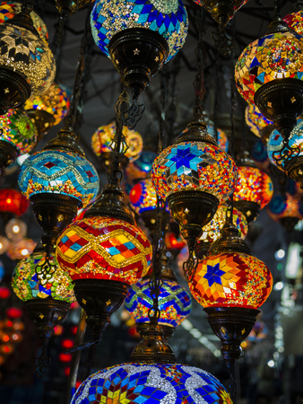 Amazing and elegant photo of ornate and colourful Turkish lights hanging from the ceiling.の写真素材