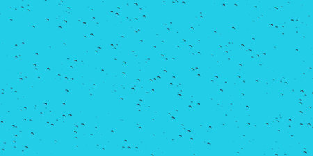 Light blue abstract background with scattered small black dots creating dotted texture perfect for fresh modern digital design work. Cool and calming color toneの写真素材