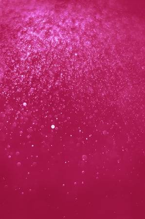 Abstract  Festive background with bokeh defocused lightsの写真素材