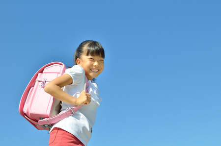 Girls laughing in the sky bagsの写真素材