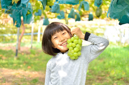 Enjoy the grape girlの写真素材