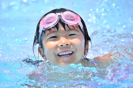 Girls swimming fun in the poolの写真素材