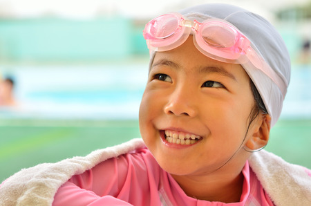 Girl laughs at poolsideの写真素材