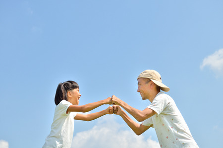 Parent-child in blue skyの写真素材