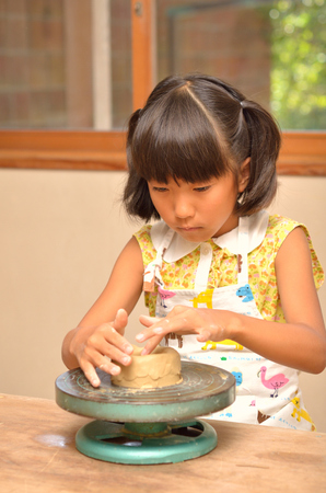 Girls enjoy potteryの写真素材