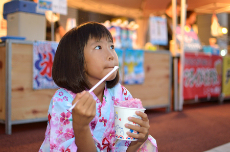 Girls enjoy summer festivalの写真素材