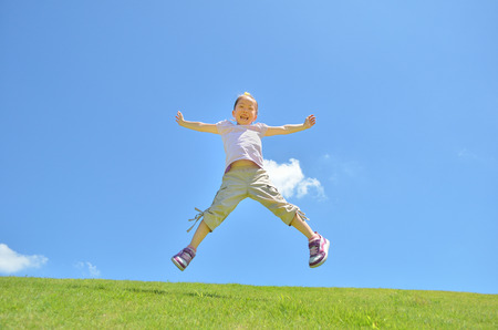 Girls jumping in the skyの写真素材