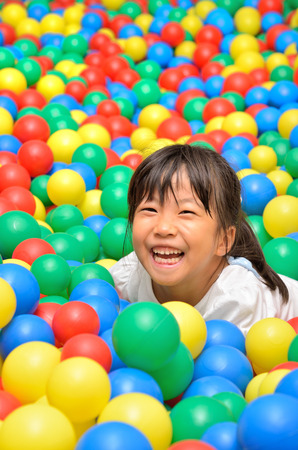 A girl playing with ballsの写真素材