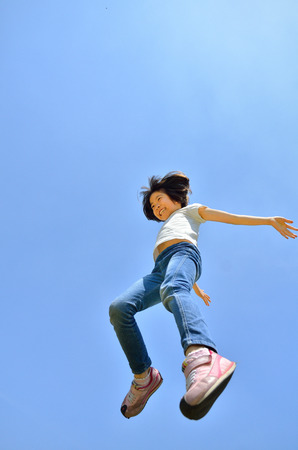 Girls jumping in the skyの写真素材