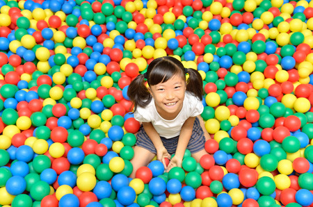 A girl playing with ballsの写真素材