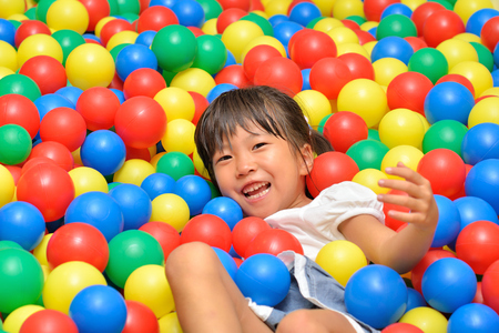 A girl playing with  ballsの写真素材