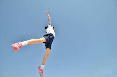 Girls jumping in the skyの写真素材