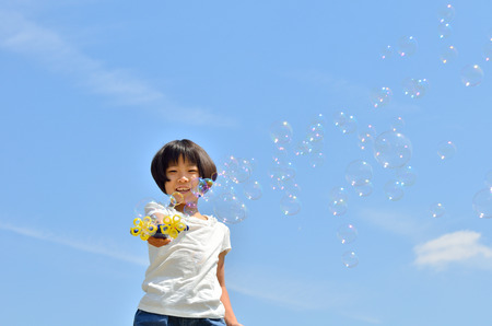 Girl with soap bubblesの写真素材