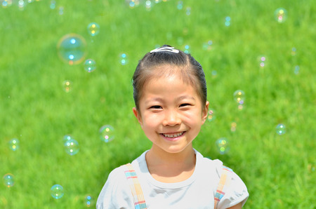 Girl with soap bubblesの写真素材