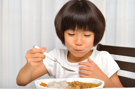 Girls eat delicious Curryの写真素材