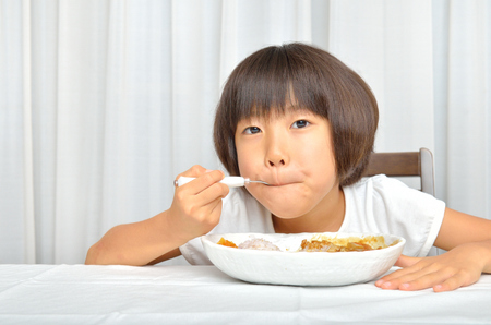 Girls eat delicious Curryの写真素材