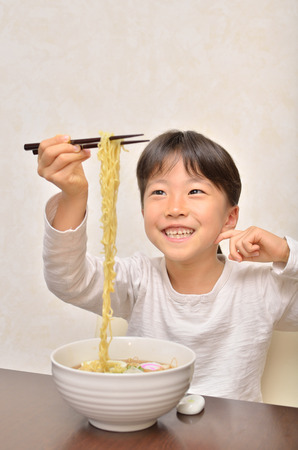 Girls eat delicious noodlesの写真素材