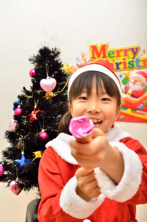 Santa Claus costume to enjoy the party girlの写真素材