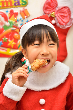 Santa Claus costume to enjoy the party girlの写真素材