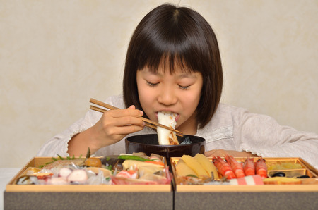 New year's dishes and girlsの写真素材