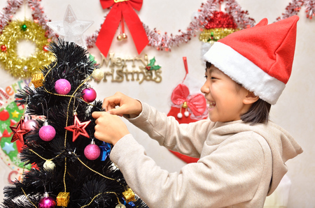 Girls enjoy Christmas party (Santa Claus costume)の写真素材