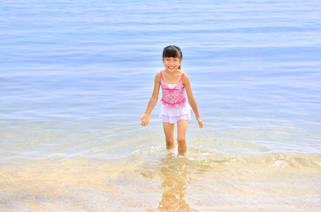 Girls enjoy sea bathingの写真素材