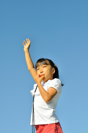 Whistling girlの写真素材