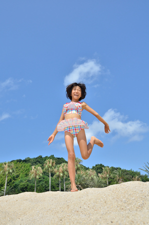 Girls enjoy sea bathingの写真素材