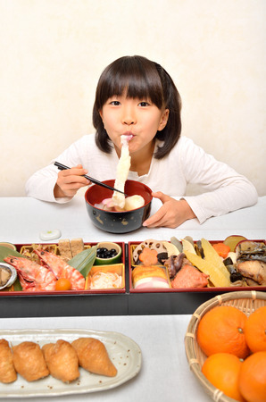 Girl enjoy japanese cuisineの写真素材