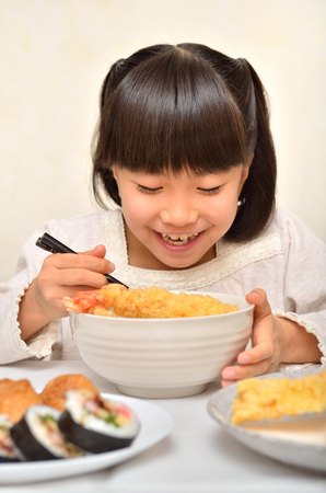 Girl enjoy japanese cuisineの写真素材